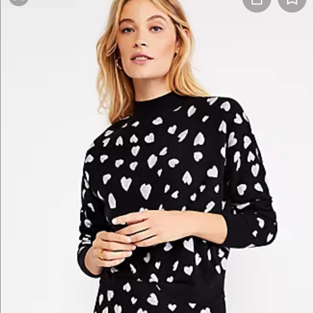 Medium Ann Taylor black crew neck sweater with white hearts.